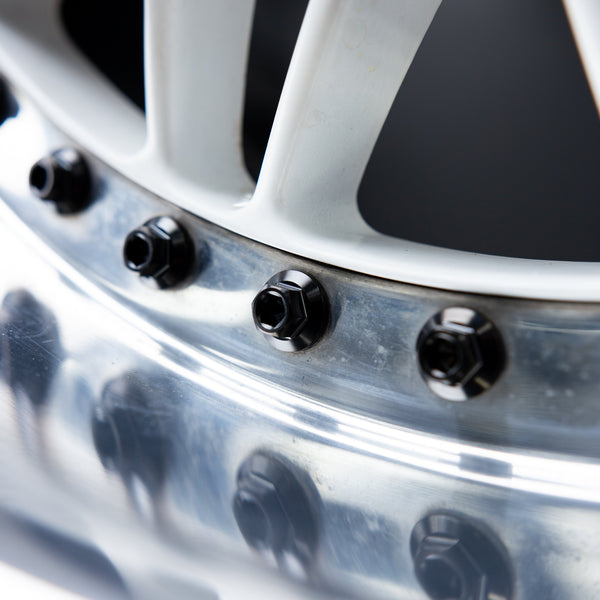 titanium 3-piece wheel bolt in black finish installed