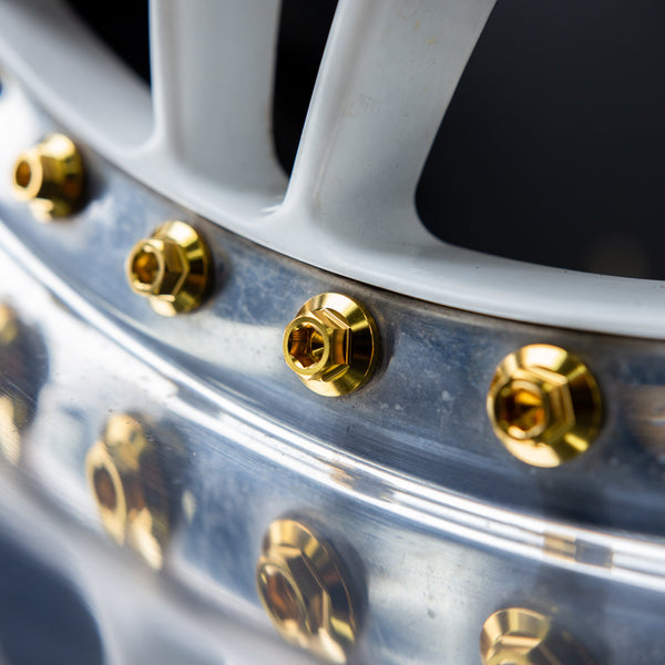 gold titanium split rim wheel bolt installed